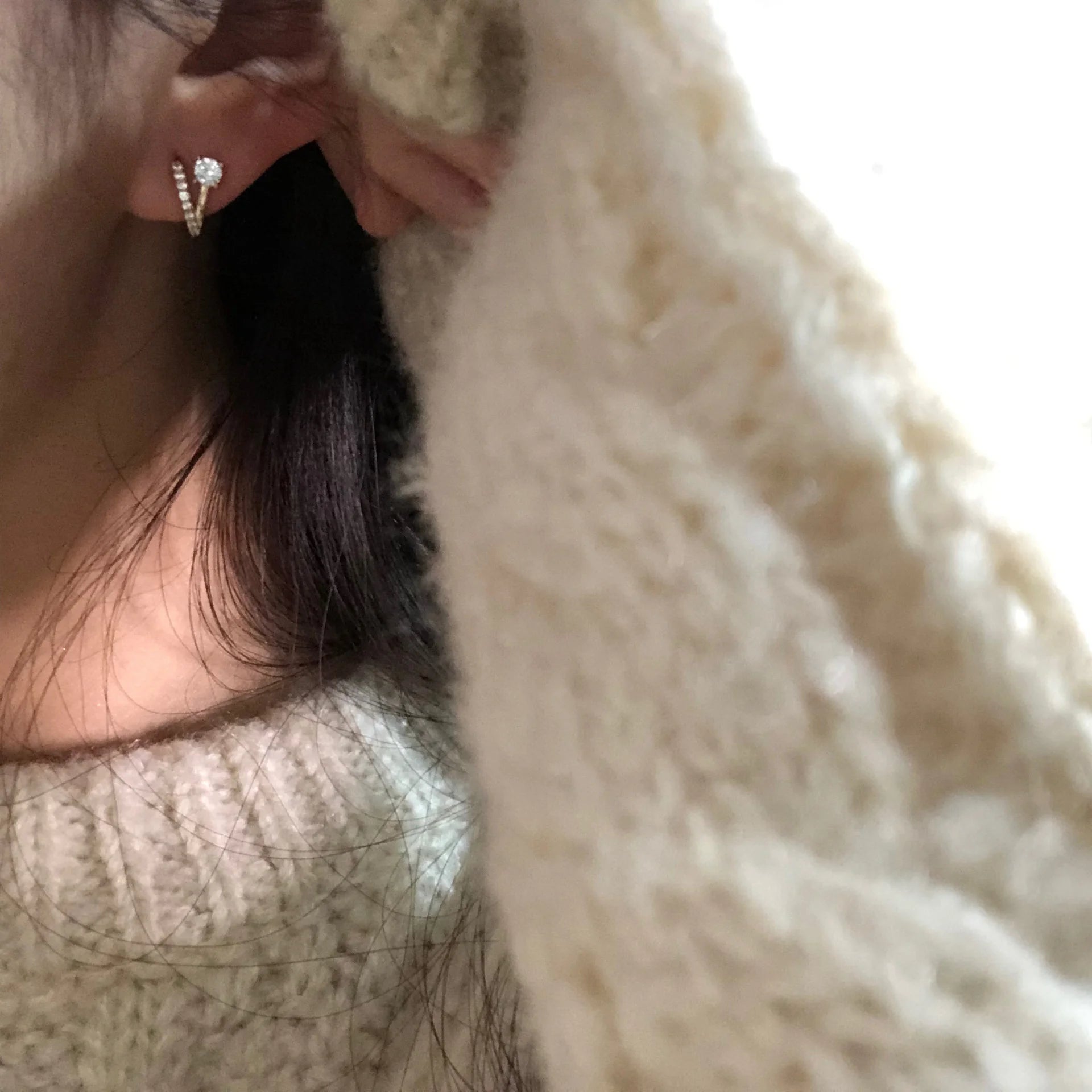 Female model wearing 18K gold plated sterling silver V-shape clip-on stud earrings with zircon