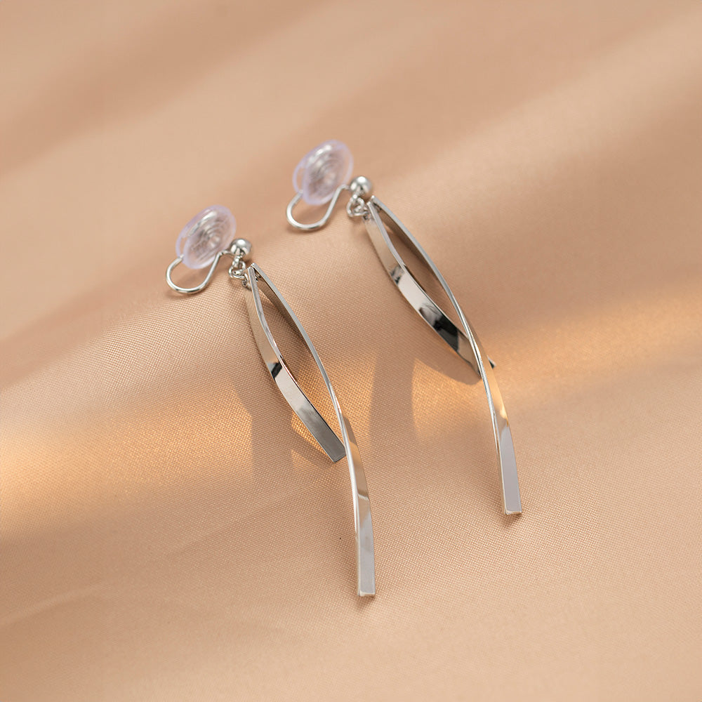 Silver ribbon dangle clip-on earrings featuring a slender, minimalist design. Made from alloy with a comfortable coil clip closure, they're perfect for all-day wear, even for non-pierced ears.