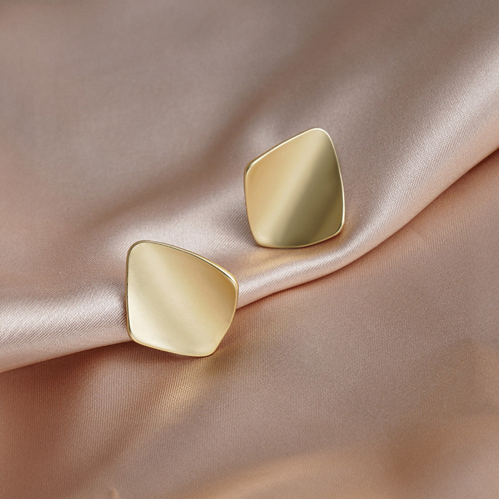 Go geometric with these gold square clip-on earrings. Eye-catching and modern, these earrings feature a chunky design that adds a touch of personality to any outfit. Made from alloy with a comfortable coil clip closure, they're perfect for all-day wear, even for non-pierced ears.