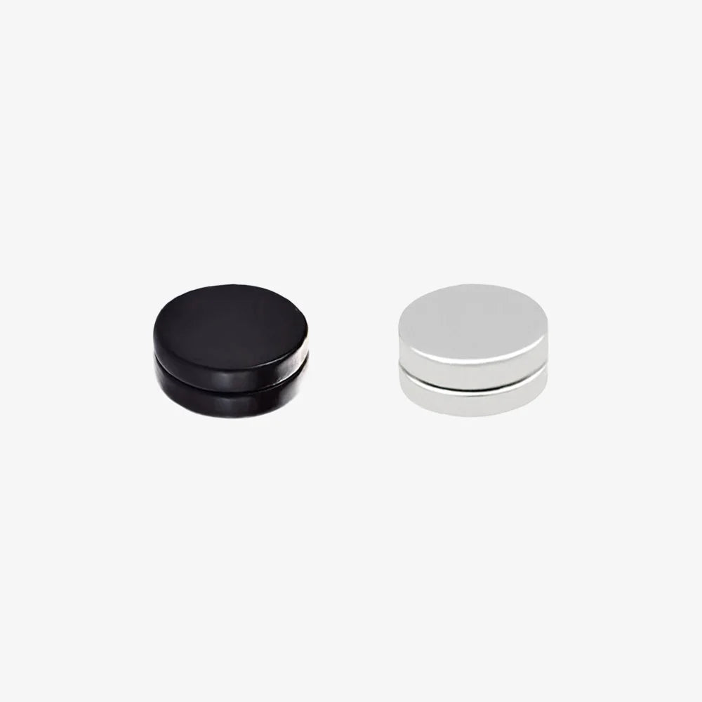 Hypoallergenic matte black and white magnetic ear studs for men, made of stainless steel.