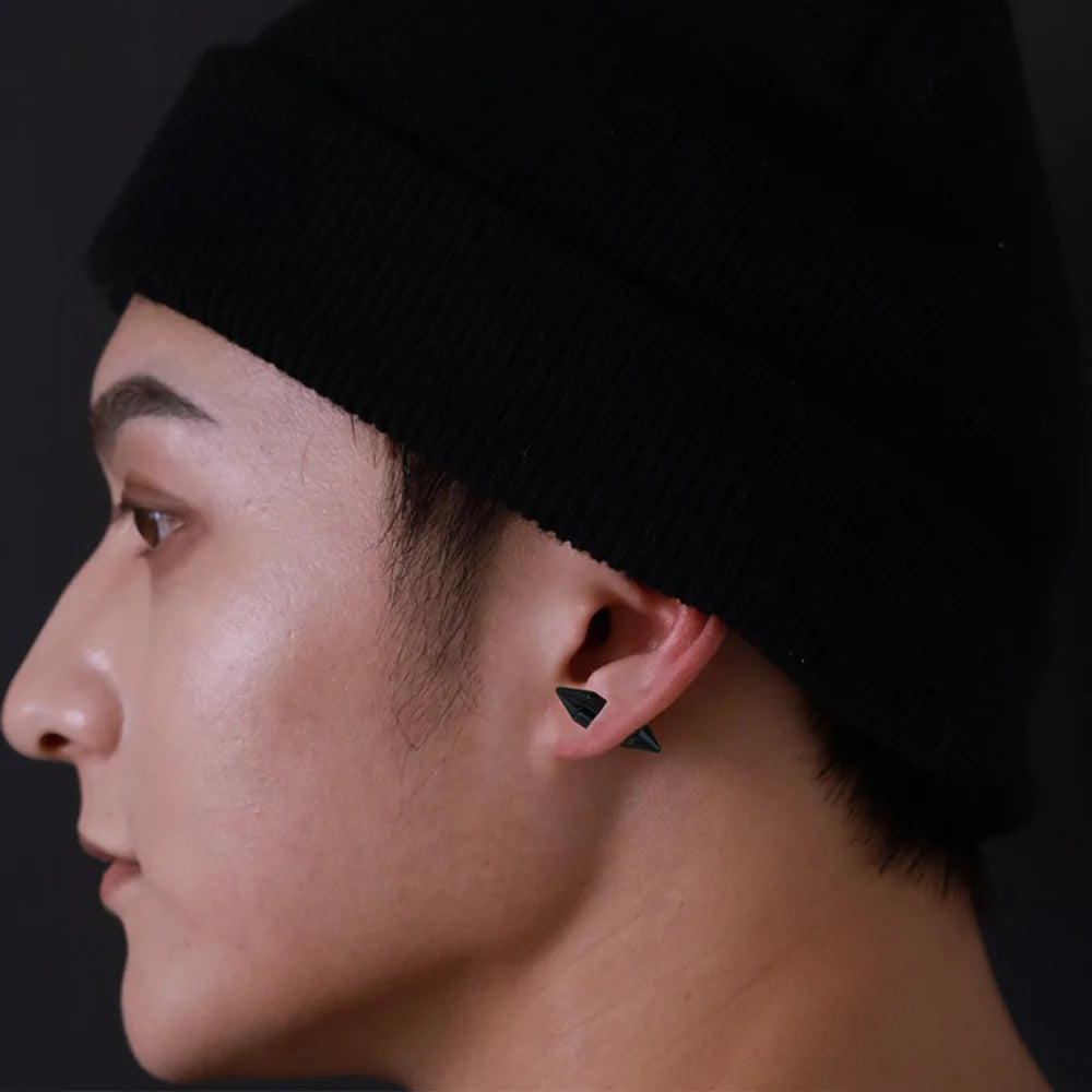 Man wearing Black Tapered Magnetic Stud Earrings for a contemporary look.