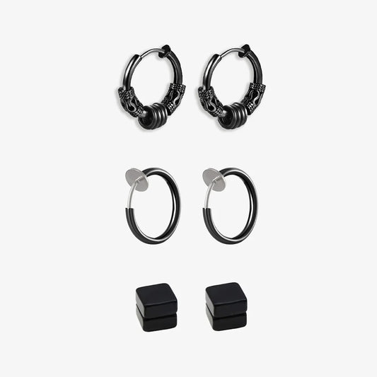A set of black clip-on earrings in various designs, including hoop earrings and magnetic ear studs, displayed against a white background.