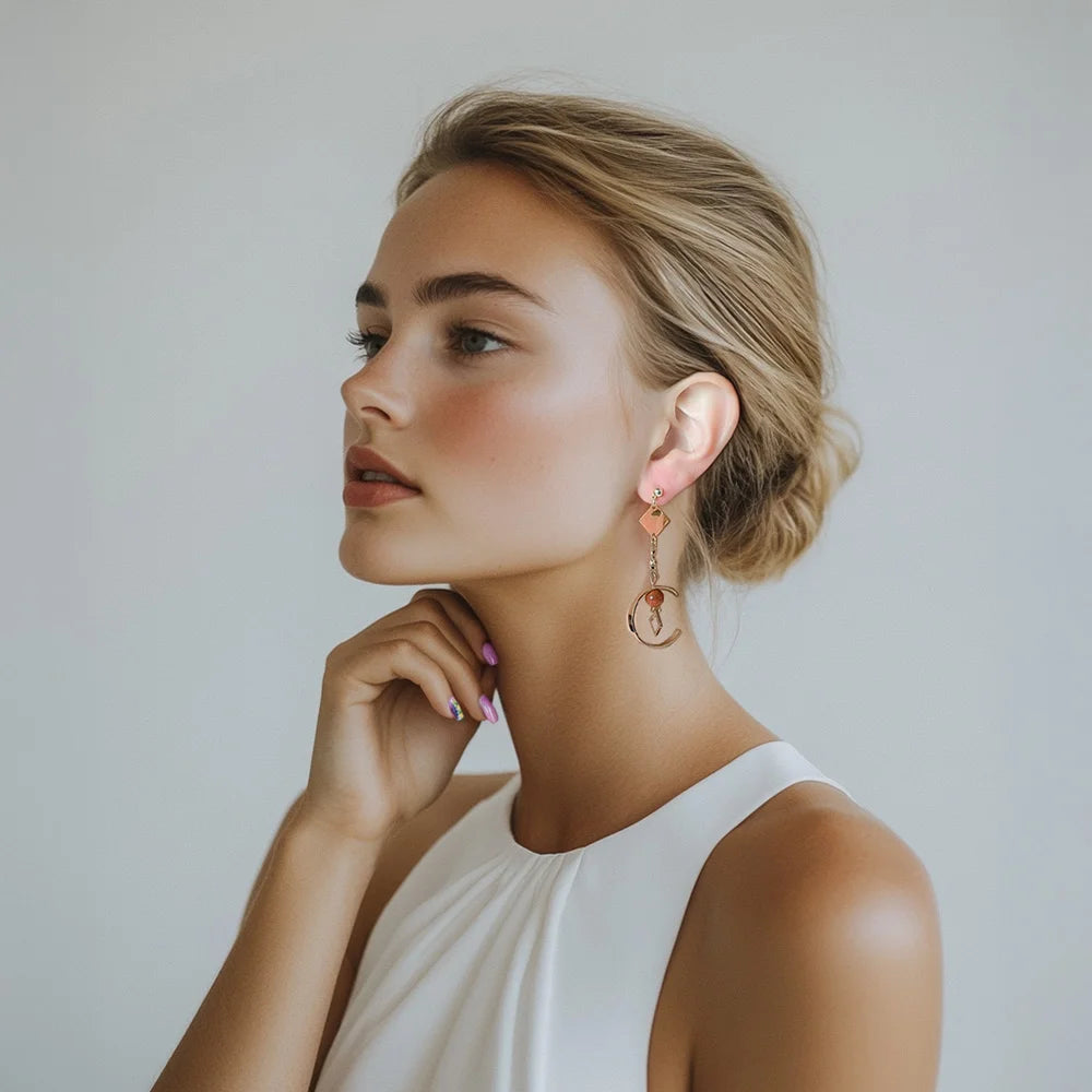 Women screw back drop earrings with a unique asymmetrical design in gold