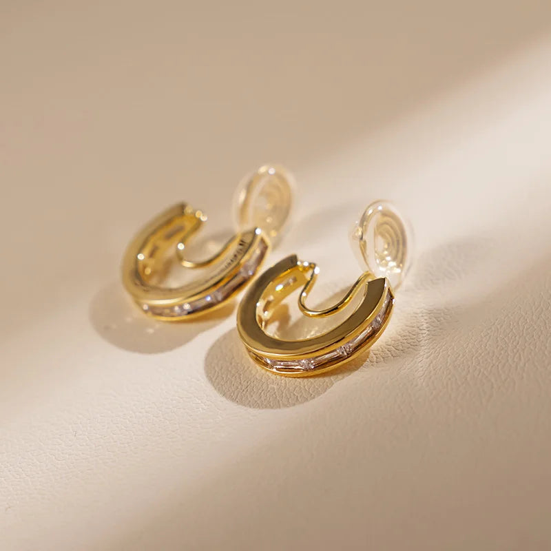 Top view of Channel-Set Zircon Clip-On Hoop Earrings showing the smooth hoop design and sparkle.