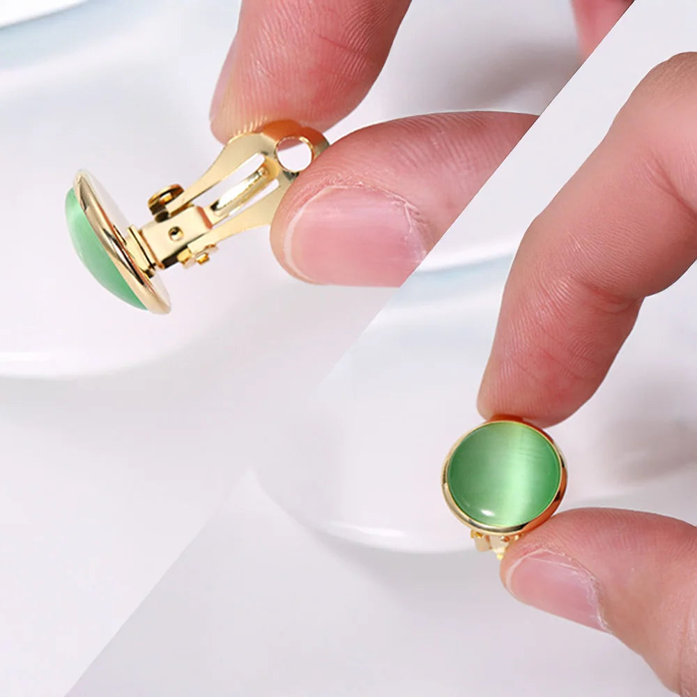 Elegant non-pierced earrings featuring green cat eye stones