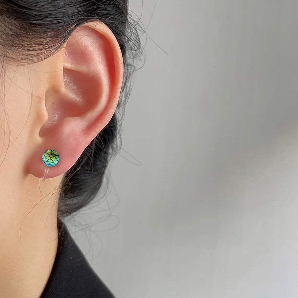 Women’s transparent clip earrings with a magical mermaid design