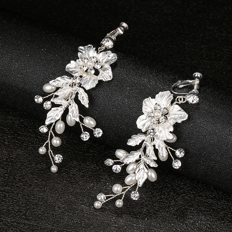 Contemporary screw back clip-on earrings for women featuring elegant ivory blooms.