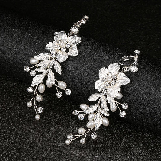Contemporary screw back clip-on earrings for women featuring elegant ivory blooms.