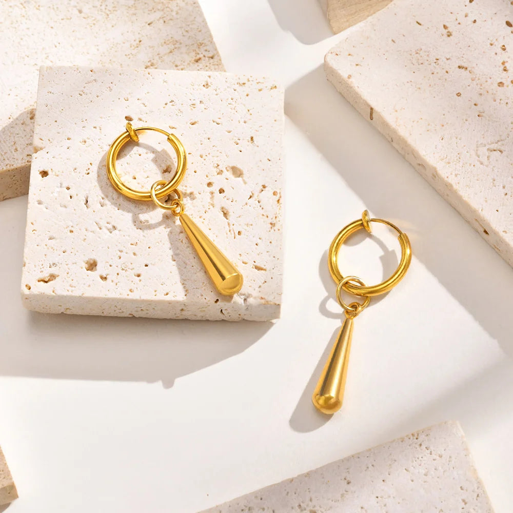 Luxurious clip-on earrings for guys in gold titanium steel, offering a comfortable and secure fit.