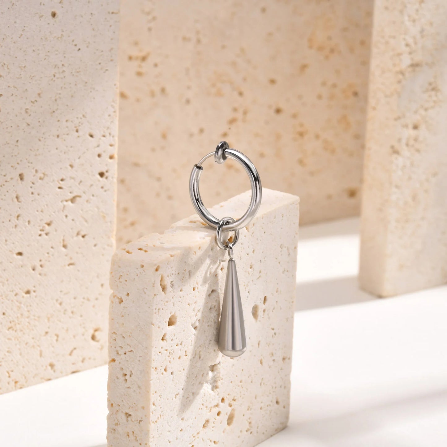 Close-up of Silver Clip-On Drop Earrings with a sleek and modern style, perfect for men’s fake earrings.