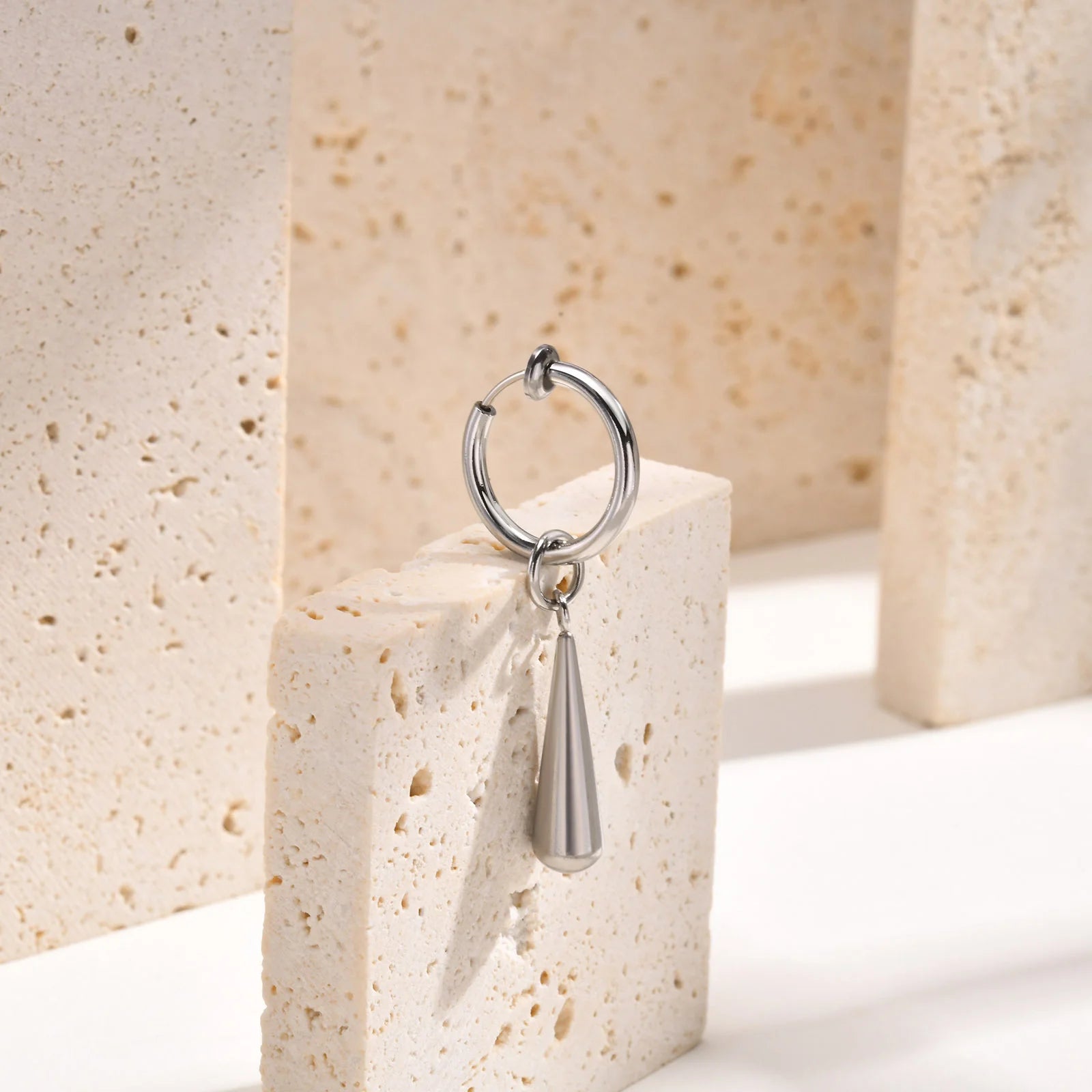 Close-up of Silver Clip-On Drop Earrings with a sleek and modern style, perfect for men’s fake earrings.