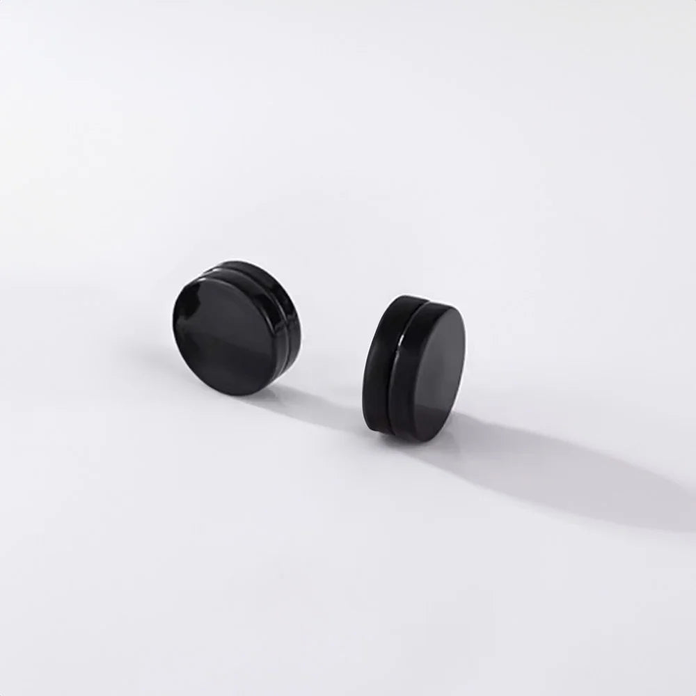 Round magnetic stud earrings in a modern matte black finish, a versatile accessory for any man's wardrobe.