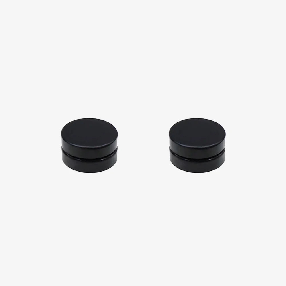 Close-up of matte black round magnetic earring for male, highlighting the smooth, non-reflective finish.