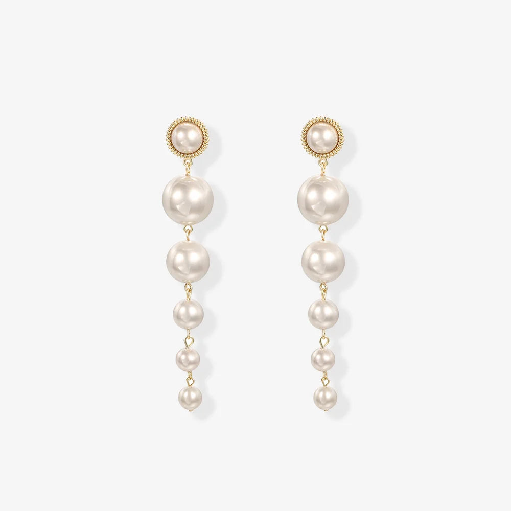 Elegant screw back clip on pearl earrings with cascading faux pearls, perfect for weddings.