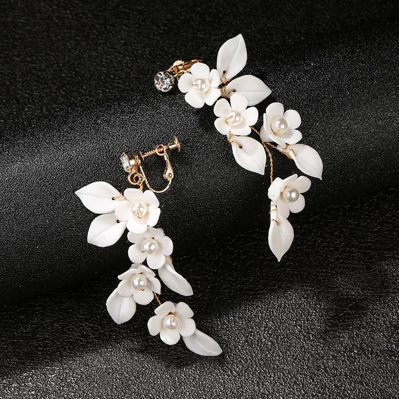 Handmade screw back clip-on earrings for brides, featuring delicate petals and pearls.