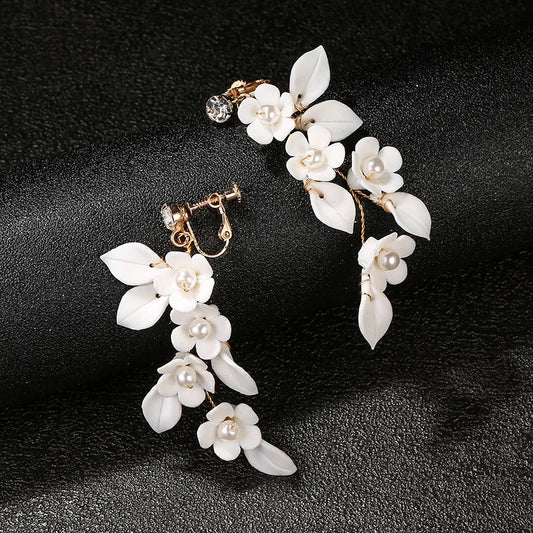 Handmade screw back clip-on earrings for brides, featuring delicate petals and pearls.