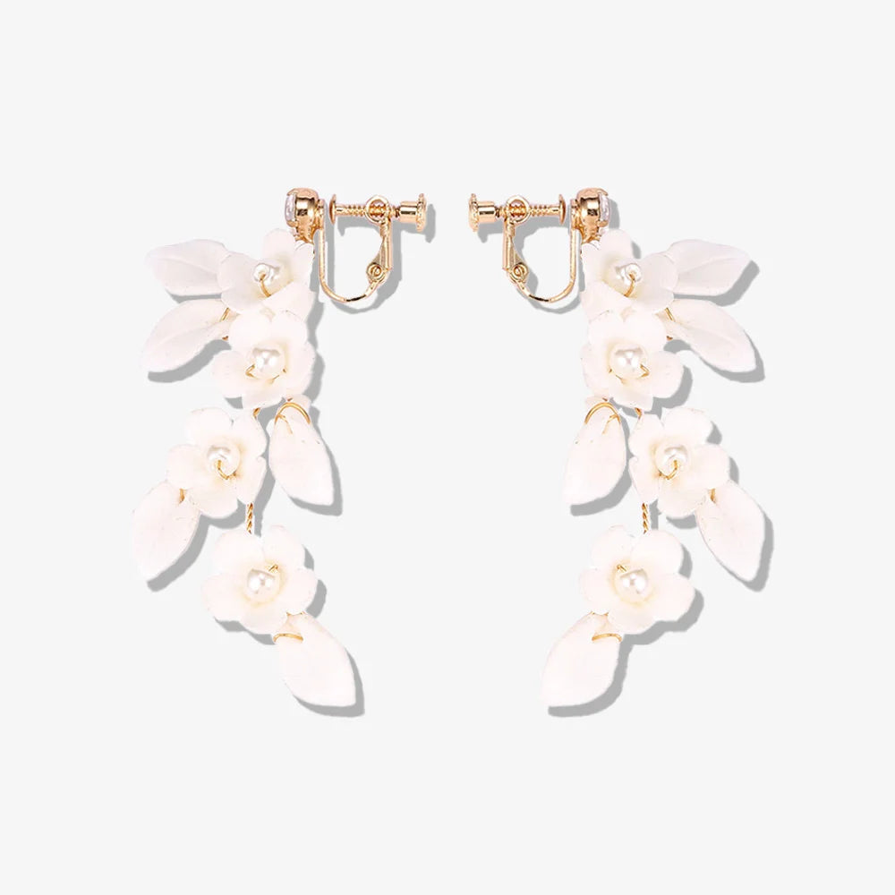 Petal Pearl Cascade Screw Back Clip-On Earrings with light ceramic floral design and faux pearls for weddings.
