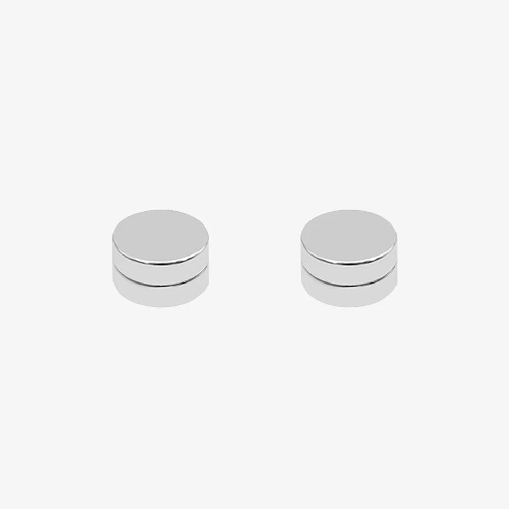 Close-up of stainless steel matte silver magnetic stud earrings, showing its smooth, non-piercing design.