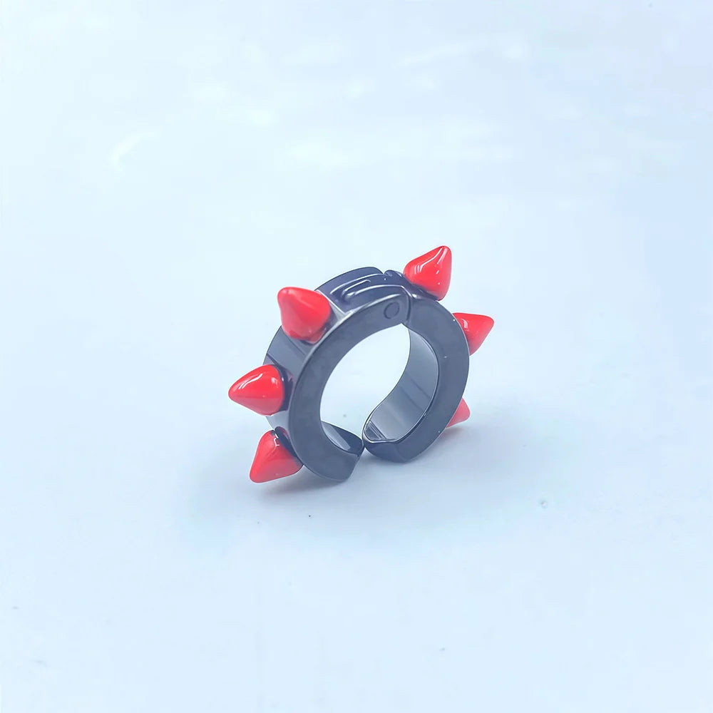 Close-up of titanium steel clip earrings with punk style