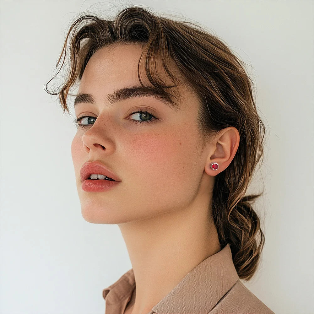 Woman wearing ruby dragon claw magnetic stud earrings, showcasing bold style and secure fit