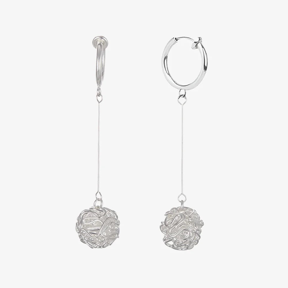 Front view of the earrings showcasing the intricate filigree design.