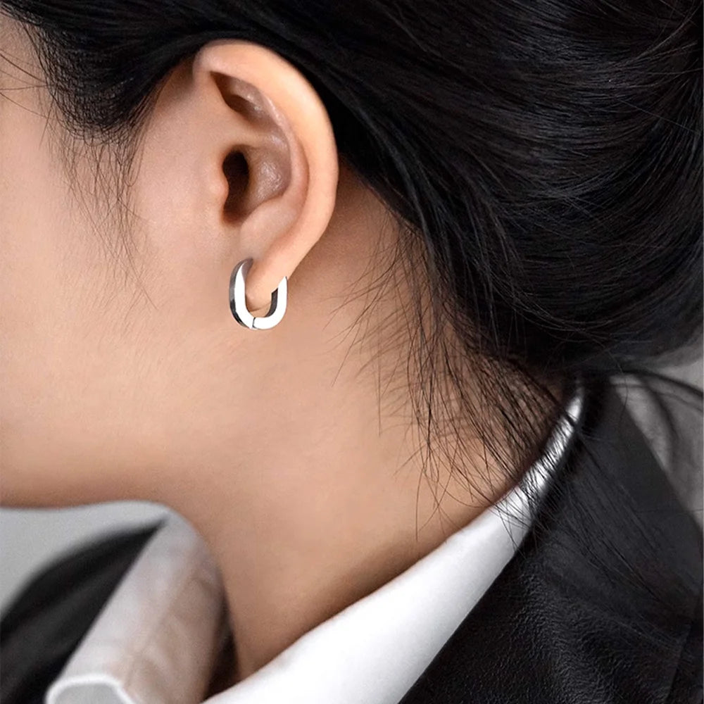 Model wearing Silver Horseshoe Clip-On Hoop Earrings.