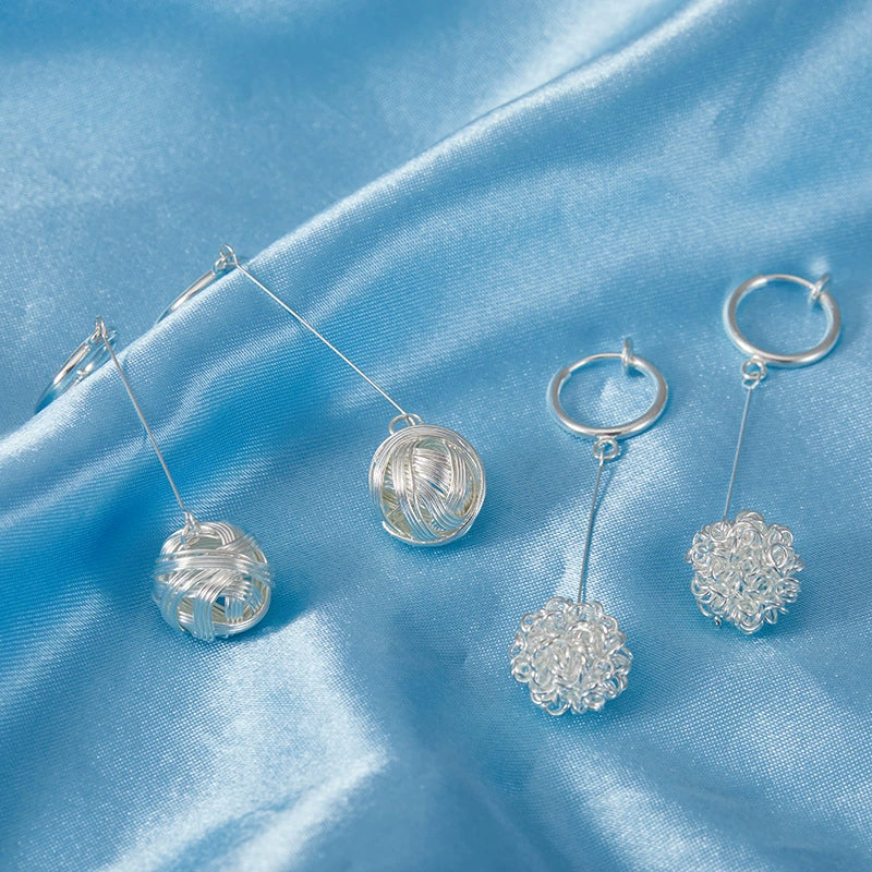 Close-up of the wire-wrapped orb, showing intricate detailing.