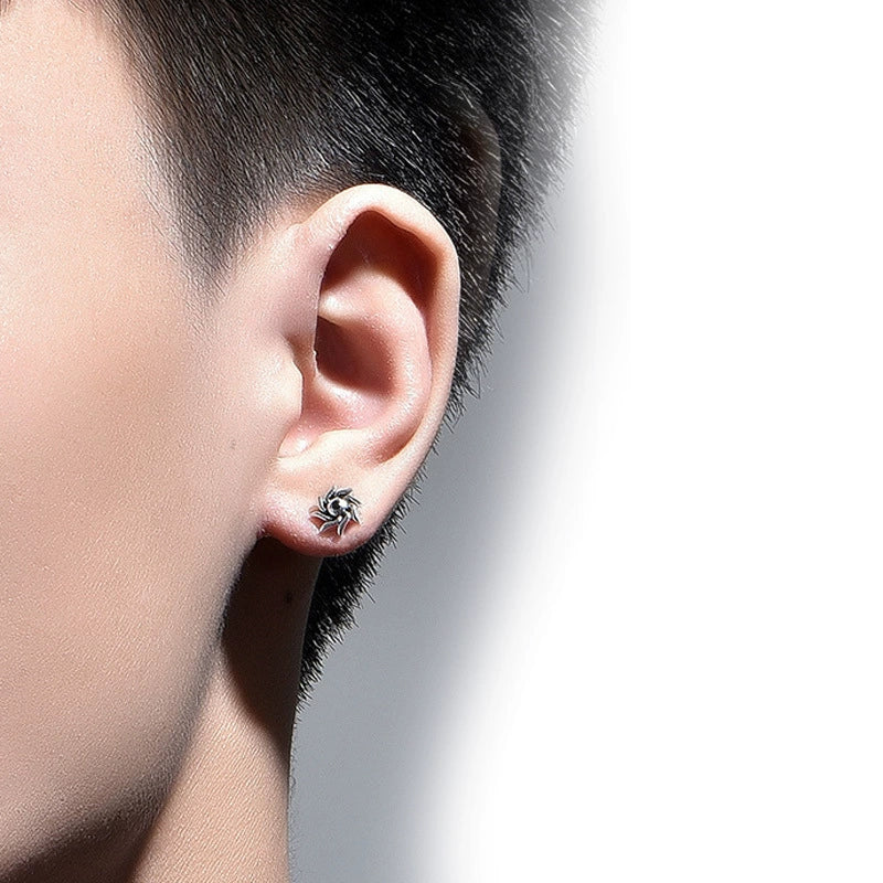 Man wearing the spiked spiral magnetic ear studs with black zircon