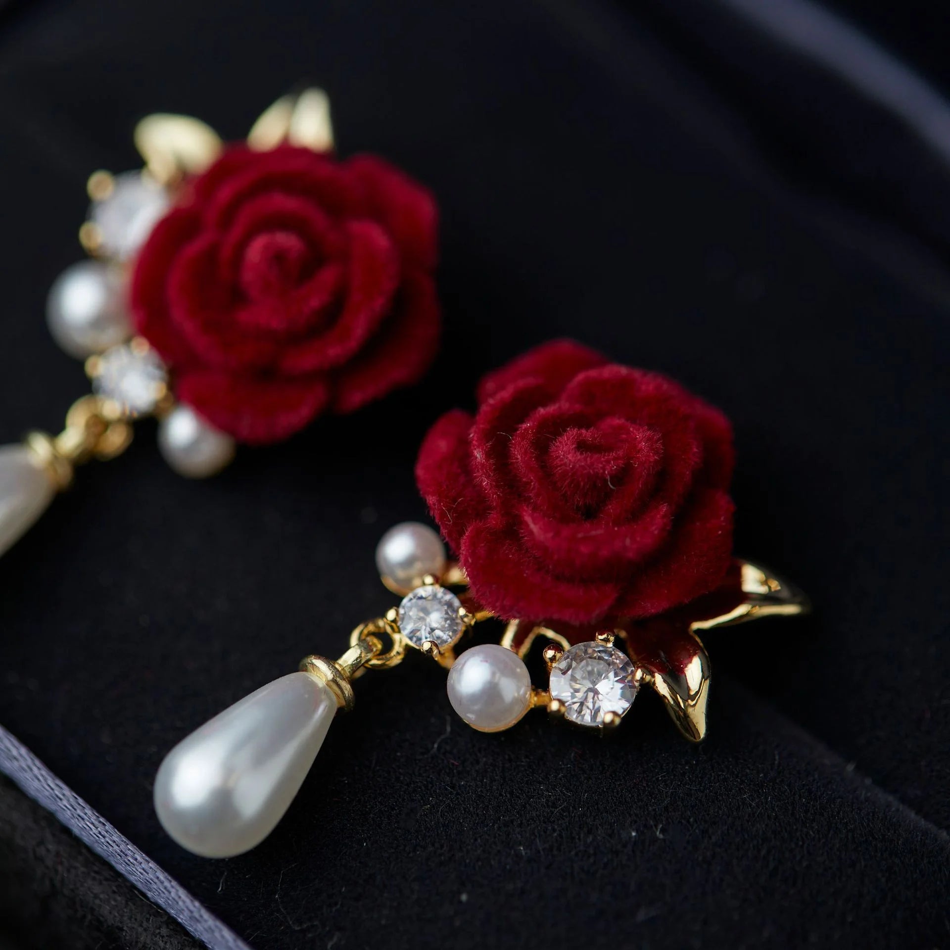 Close-up of Velvet Rose Clip-On Earrings, showcasing intricate design with zircons and pearls.