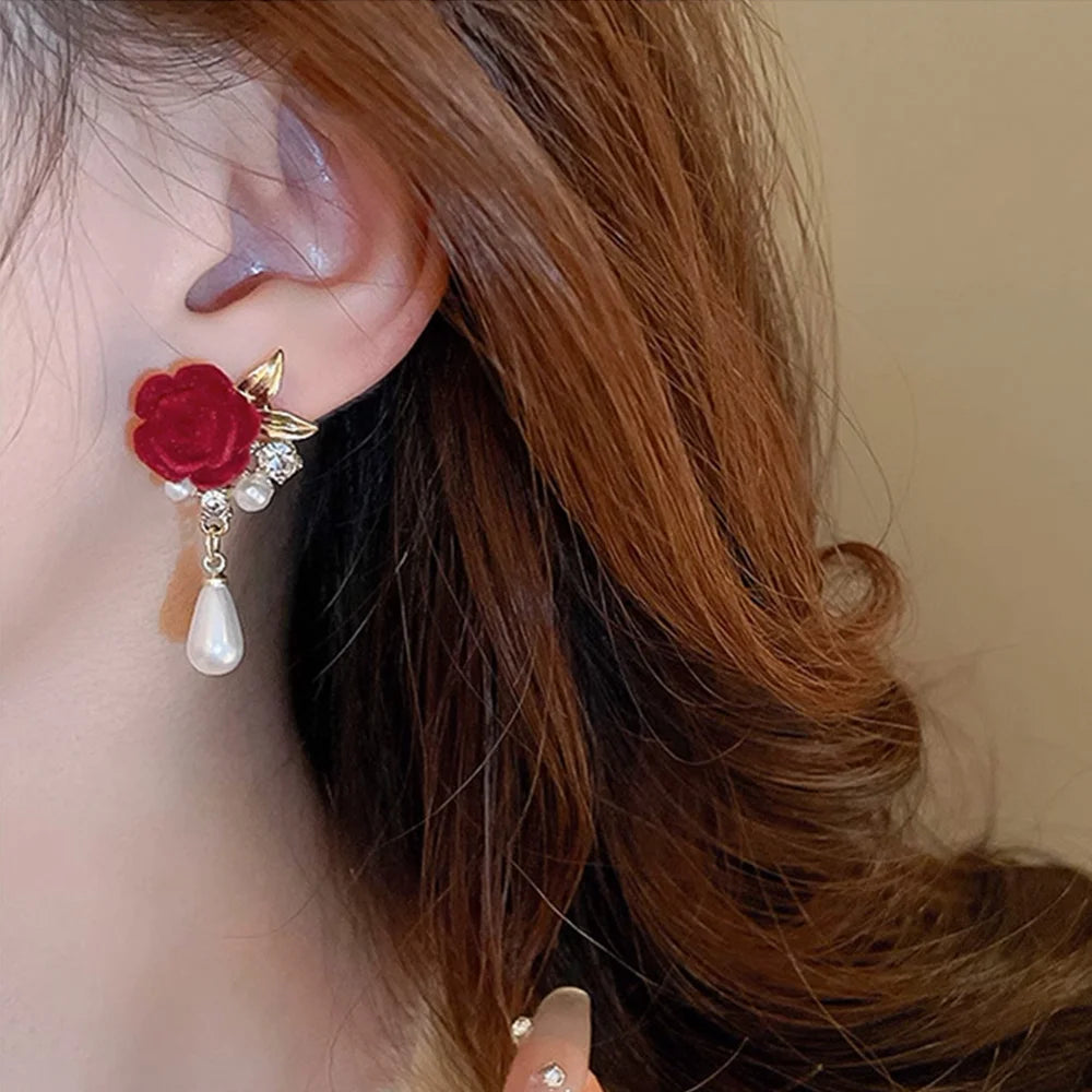 Model wearing Velvet Rose & Pearl Drop Clip-On Earrings, perfect for a sophisticated bridal look.