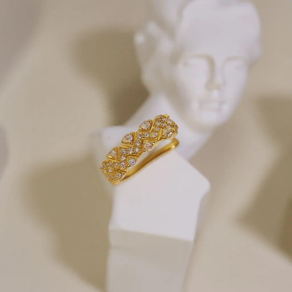 Pave chevron gold ear cuff displayed on a white bust, highlighting its Art Deco-inspired design.