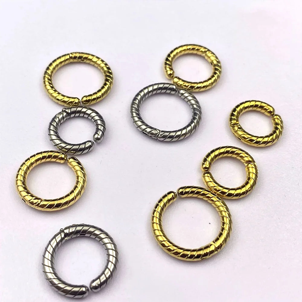 A collection of twisted rope spring-action clip-on hoop earrings in both gold and silver finishes and various sizes.