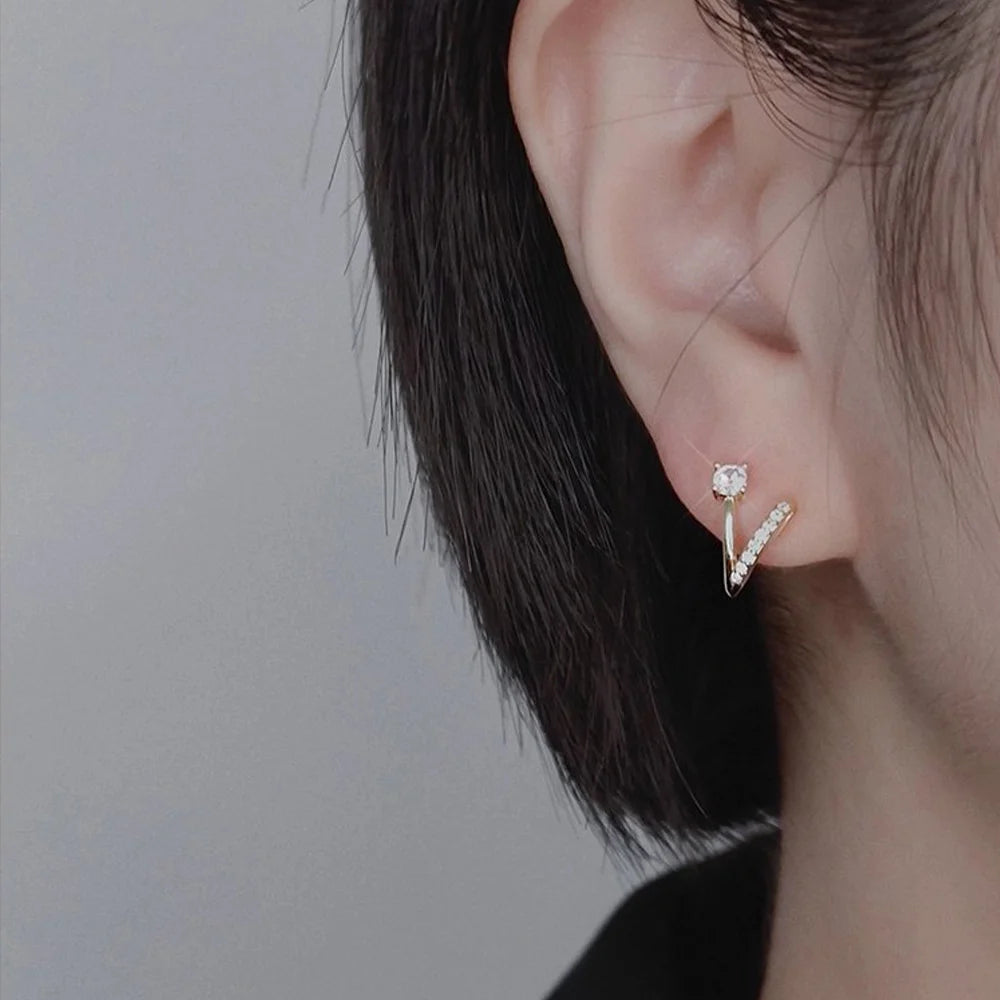 Close-up of woman's ear showcasing hypoallergenic 18K gold plated zircon clip-on earrings