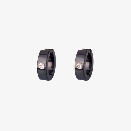 A pair of minimalist men's clip-on hoop earrings in black with a single inset cubic zirconia stone, shown isolated on a white background.