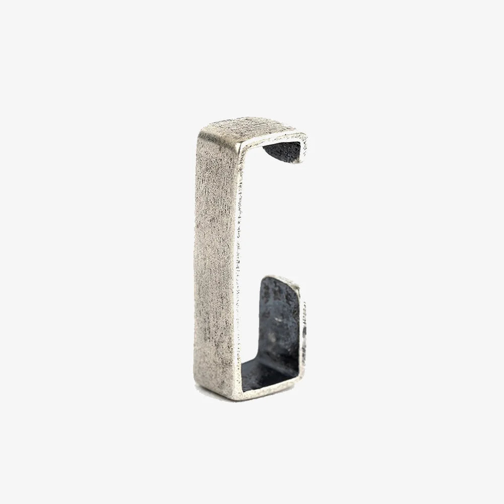 A single minimalist rectangular bar ear cuff in a brushed sterling silver finish, shown isolated on a white background.