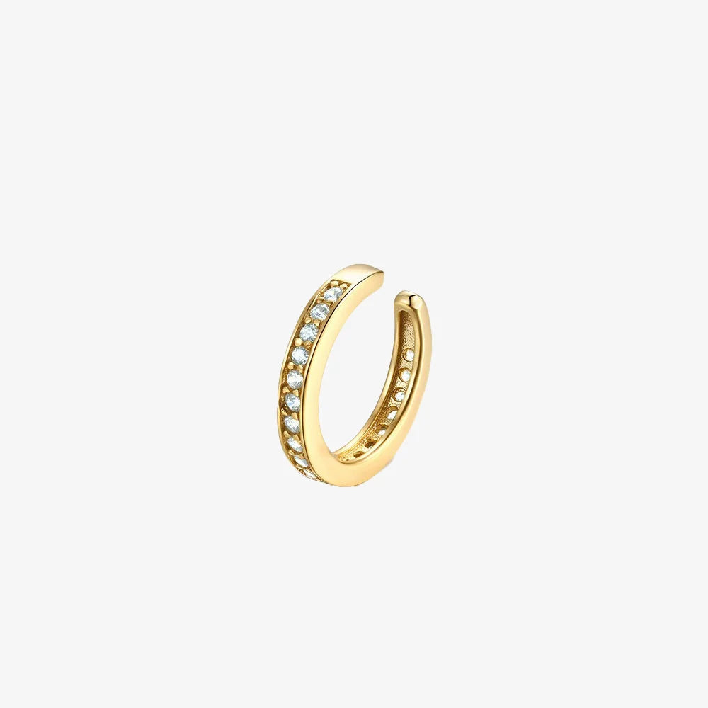 Stardust pavé zirconia gold cartilage ear cuff on a clean white background.
