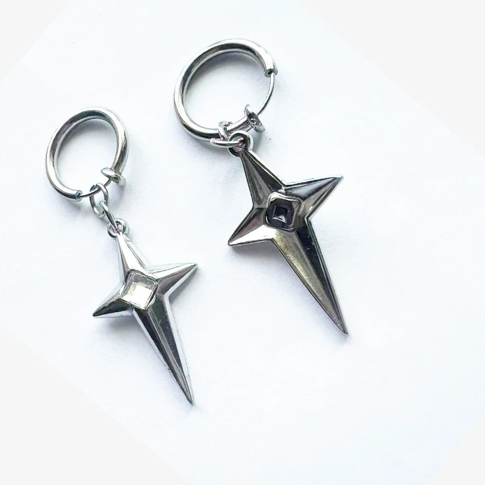 A close-up of the polaris star clip-on hoop earring with a white gem, showing the detailed front and the smooth, polished back of the charm.