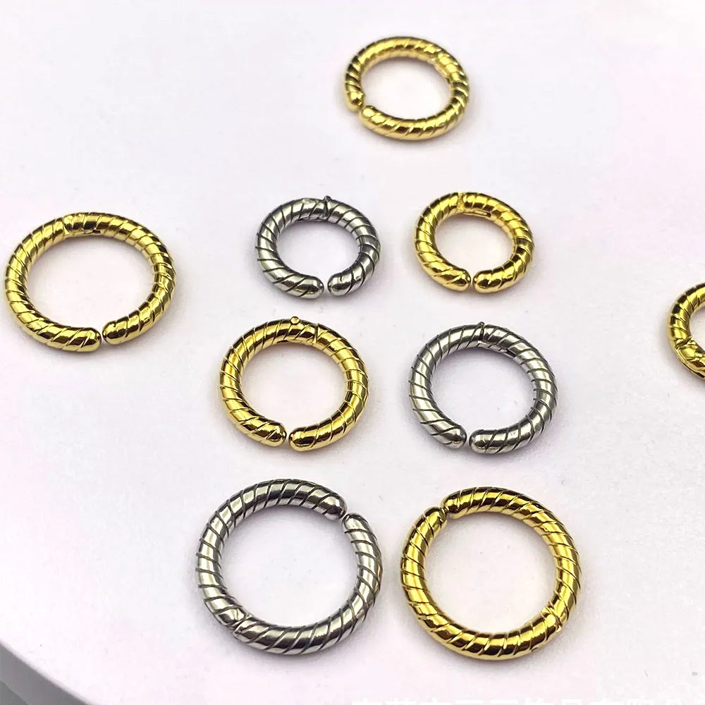 An assortment of unisex non-pierced hoop earrings with a twisted texture, available in gold and silver for cartilage, lobe, or nose.