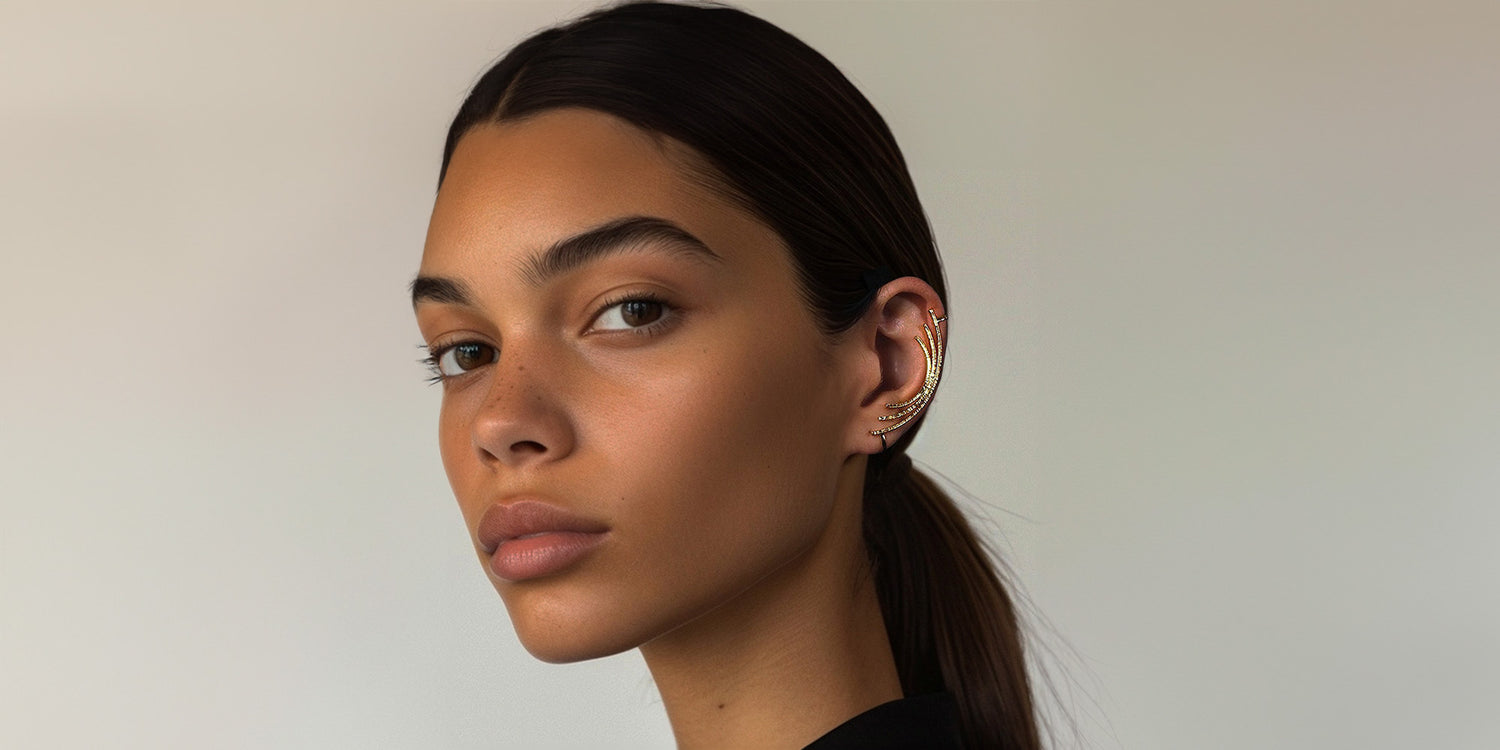 Woman showcasing Gold Linear Contour Ear Climber, perfect for a sophisticated date look or to make a statement at social gatherings, non-piercing fit.