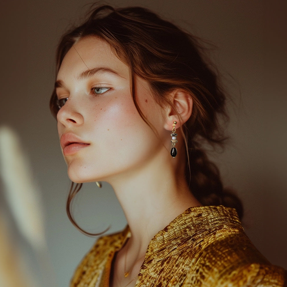 Black Gemstone Drop Clip-Ons earrings featuring black gemstone (stone) and resin, these earrings bring earthy elegance to your boho chic look. The comfortable coil clip-on closure makes them a versatile and stylish choice.