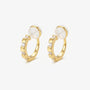 A pair of 16k yellow gold finished huggie clip on earrings with sparkling baguette cubic zirconia in a lattice setting.