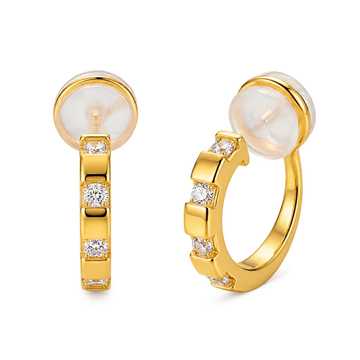 A pair of 16k yellow gold finished huggie clip on earrings with sparkling baguette cubic zirconia in a lattice setting.