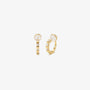 A pair of 16k yellow gold finished huggie clip on earrings with sparkling baguette cubic zirconia in a lattice setting.