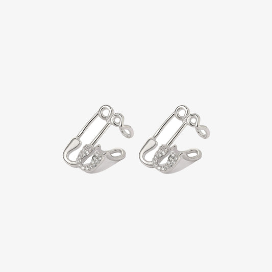 Pair of Dual Paperclips Conch Ear Cuffs isolated on a white background, showcasing the durable copper construction with a white gold finish and adorned with sparkling zircons, reflecting a chic and playful jewelry design.