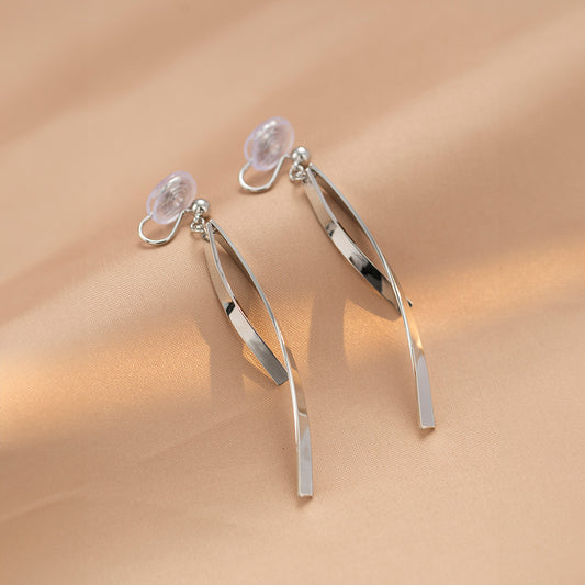 Silver ribbon dangle clip-on earrings featuring a slender, minimalist design.  Made from alloy with a comfortable coil clip closure, they're perfect for all-day wear, even for non-pierced ears.