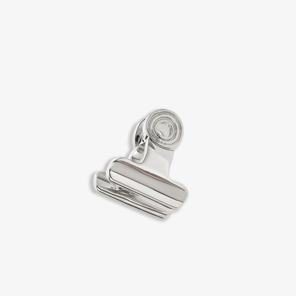 The Bull Clip Charm Helix Ear Cuff in a polished white gold finish, a playful accessory that can take your work wear up a notch or add a creative touch to your date night ensemble.