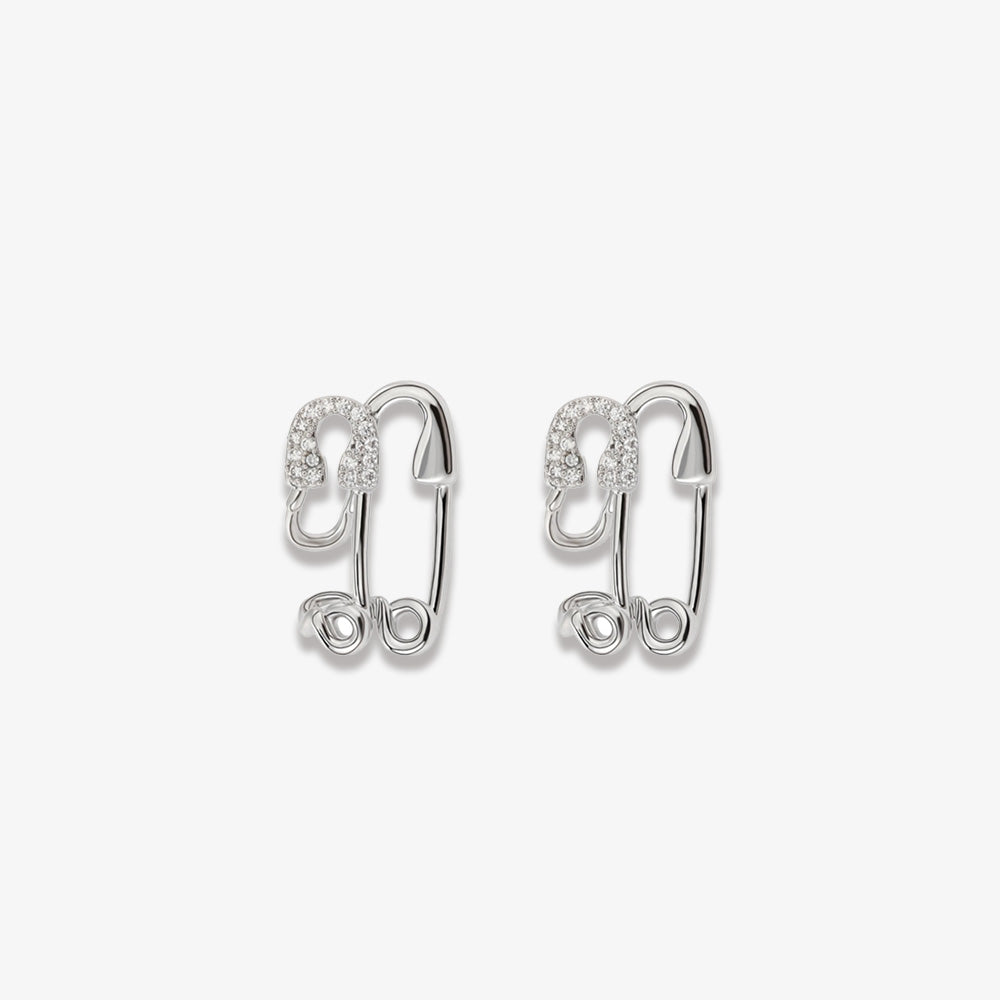 White gold-finished Dual Paperclips Conch Ear Cuffs with zircon detailing, presented on a white backdrop, embodying a whimsical yet luxurious accessory that adds a unique twist to both day and evening wear.