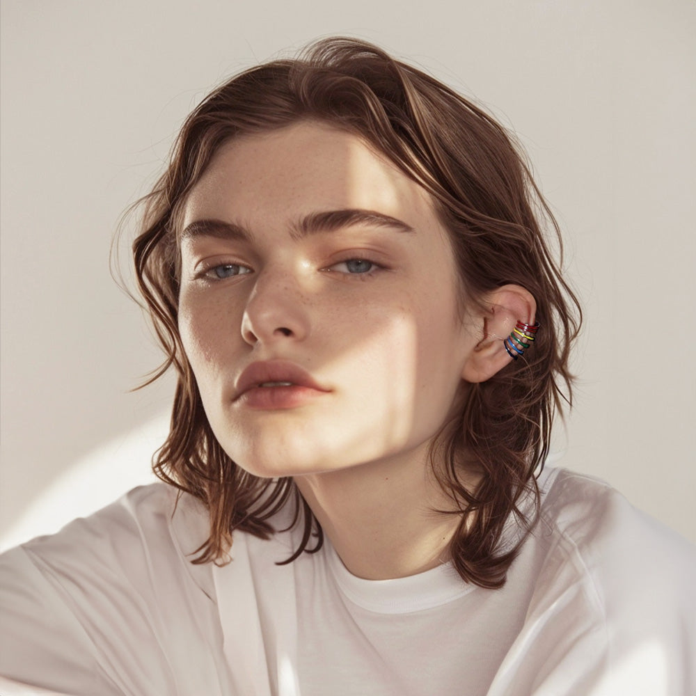 Profile view of a model with a Rainbow Conch Ear Cuff, each color standing out to add a spirited accent to daily outfits or a symbolic touch for LGBT events, infusing style with meaning.