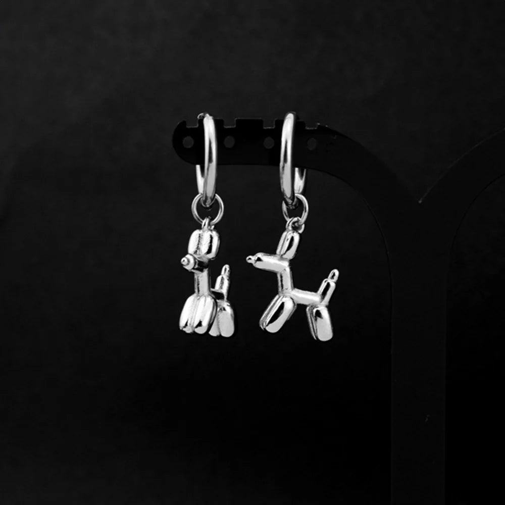 Silver balloon doodle dog clip-on earrings front view displayed on black earring stand