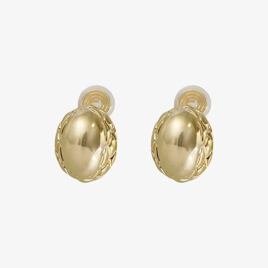 Main photo of Basket Weave Oval Clip-On Earrings on a white background, showcasing the intricate texture and polished gold finish.